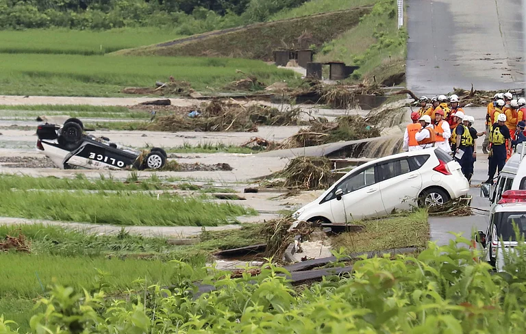 A police vehicle is seen overturned following a heavy rain in Shinjo, Yamagata prefecture, northern Japan Friday, July 26, 2024.
- AP
